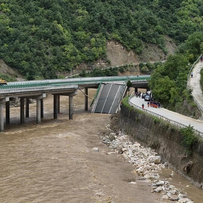 11 dead and dozens missing after a highway bridge in China crumbles in flooding and heavy storms